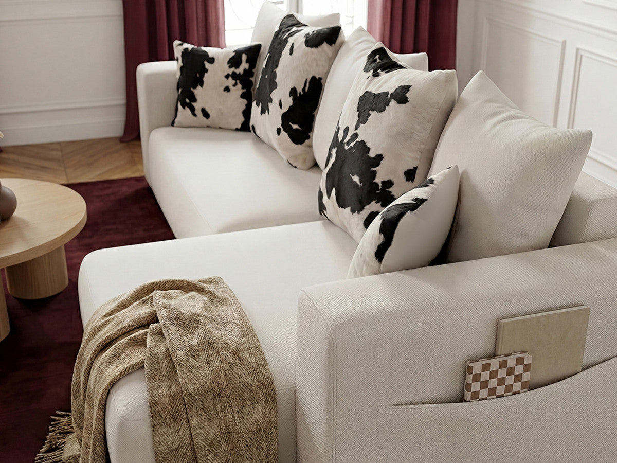 Canapé d'angle convertible réversible coffre SIDONIE avec coussins à motif vache