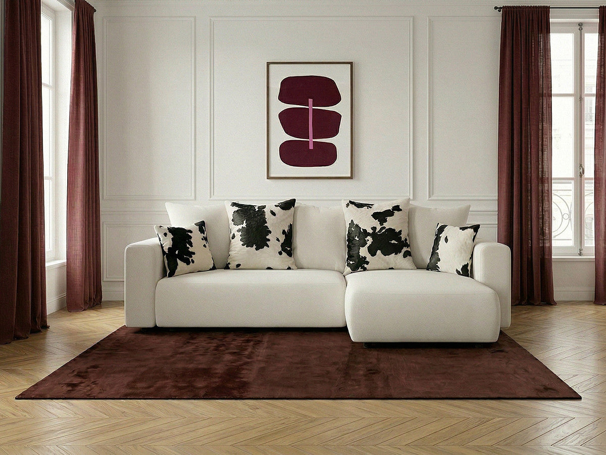 Canapé d'angle convertible réversible coffre SIDONIE avec coussins à motif vache