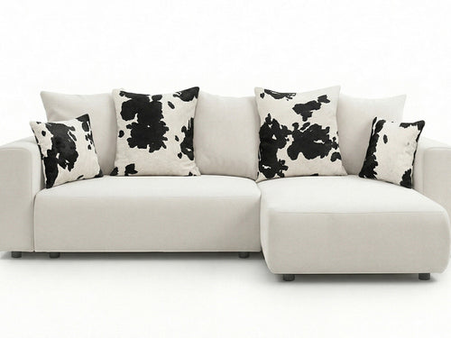 Canapé d'angle convertible réversible coffre SIDONIE avec coussins à motif vache
